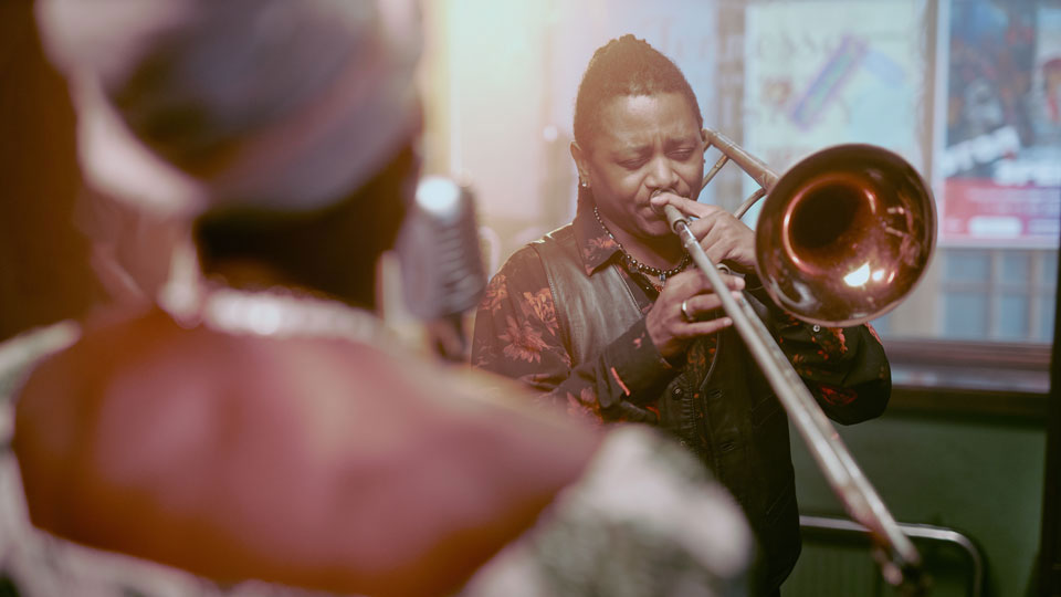 man playing a trombone from the brass instrument family