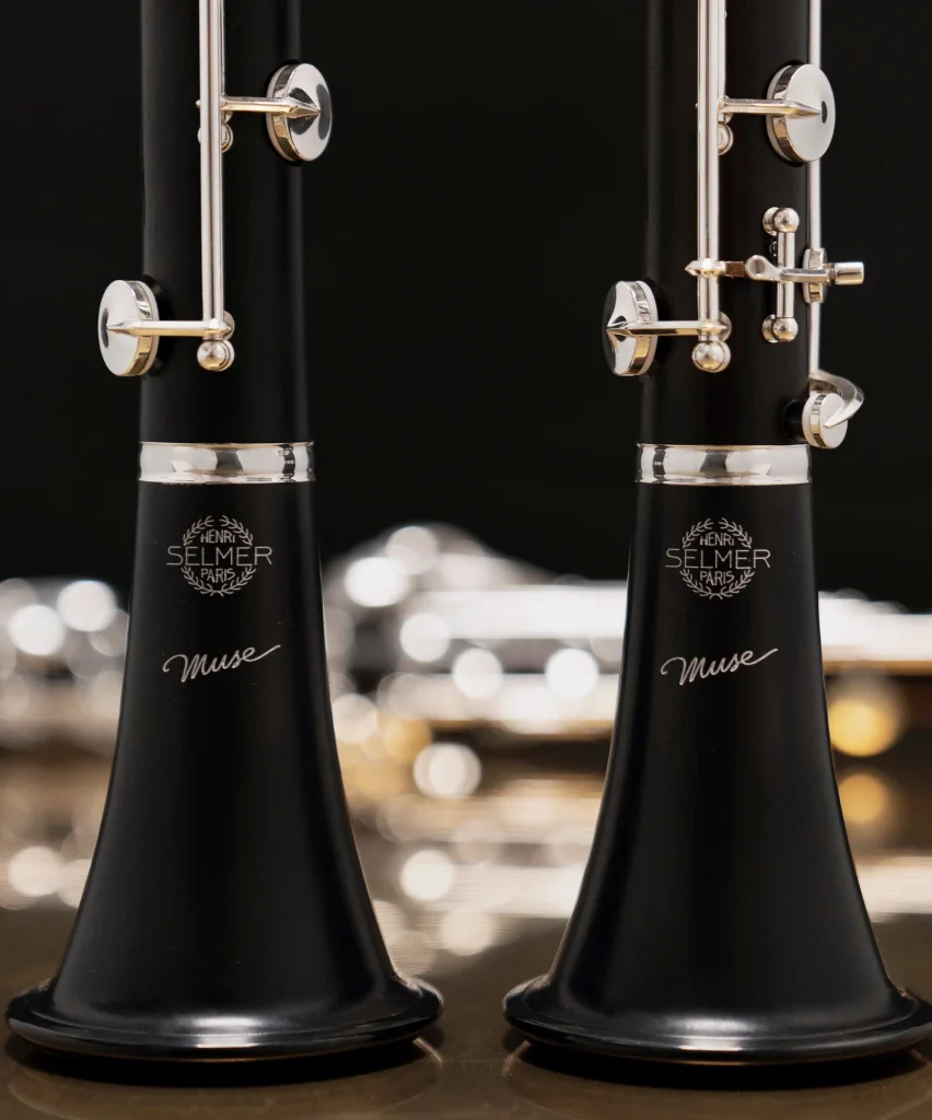 Image shows photographs of two Muse clarinets, showing the bell with the 'Muse' and selmer logo detailing and start of lower joint showing the correction key.