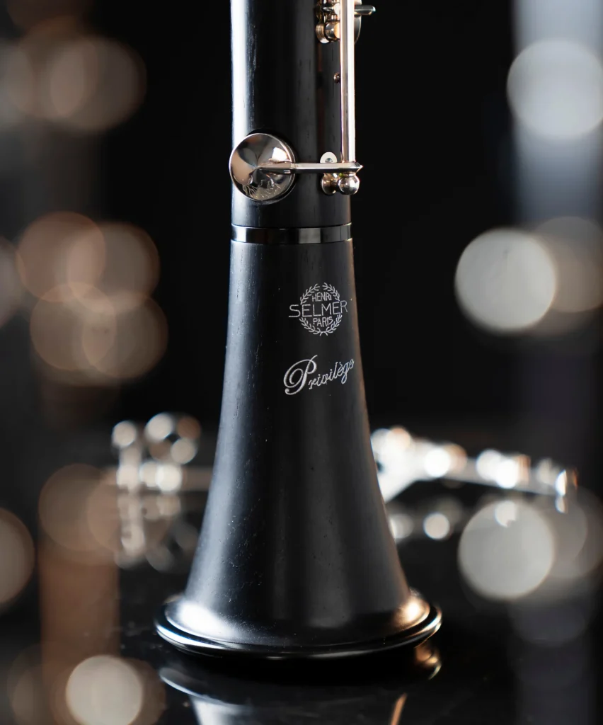 Image shows a photograph of the bell with the 'privilege' detailing and start of lower joint of the Selmer Privilege Bb Clarinet.
